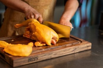 Pro Chef Black Walnut cutting board with juice groove and recessed grips; can be used on both sides 33