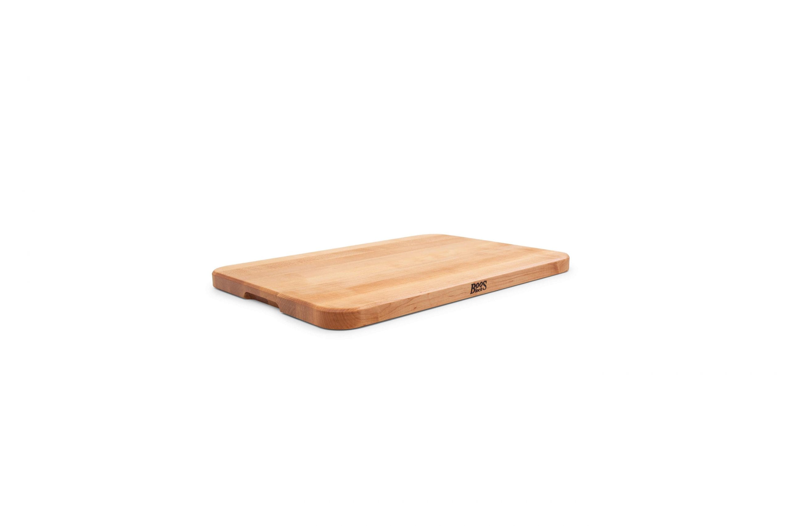 Chop-N-Serve hard maple chopping board with recessed grips; can be used on both sides 37